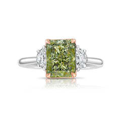 Natural greenish yellow diamond engagement ring featuring a radiant cut center stone with VVS2 clarity.