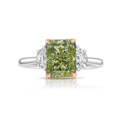 Natural greenish yellow diamond engagement ring featuring a radiant cut center stone with VVS2 clarity.