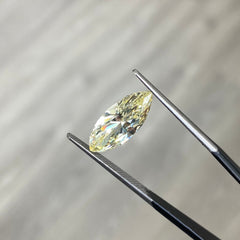 Fancy Yellow marquise cut diamond with VS1 clarity and no fluorescence.