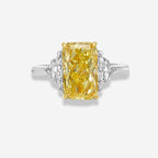 Fancy intense yellow elongated radiant cut ring white background