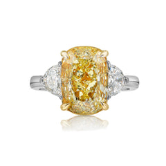 Unique elongated yellow diamond ring featuring a GIA certified diamond.