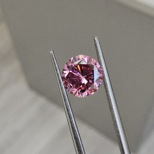 Natural fancy intense pink diamond, rare round pink diamond.