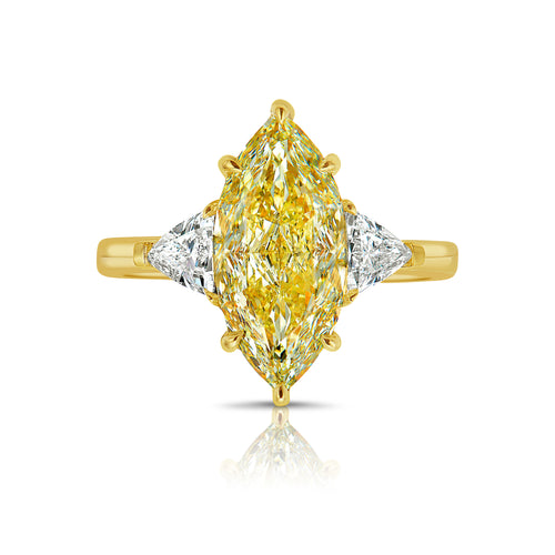 GIA certified yellow marquise cut diamond ring featuring a light yellow center diamond with excellent cut.