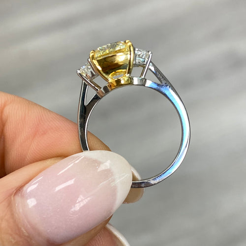 Unique elongated yellow diamond ring featuring a GIA certified diamond.