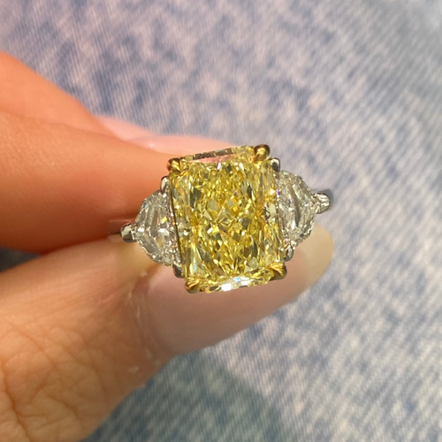 Elongated fancy yellow diamond ring