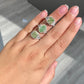 3.13 Carat GIA Green Diamond Ring with white step cut diamond side stones