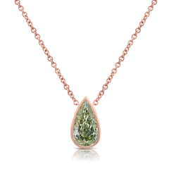 Stunning green pear-shaped diamond pendant in a pink bezel setting with SI1 clarity.