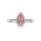 Pink diamond ring. pink diamond engagement ring. light pink diamonds. light pink pear shape. diamond ring. Pear diamond ring.