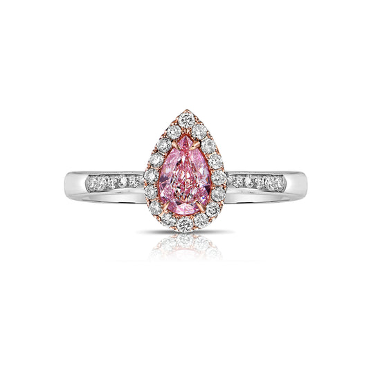 Pink diamond ring. pink diamond engagement ring. light pink diamonds. light pink pear shape. diamond ring. Pear diamond ring.