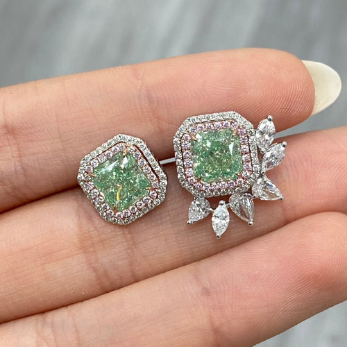 Unique green diamond stud earrings surrounded by natural pink and white diamond halos.