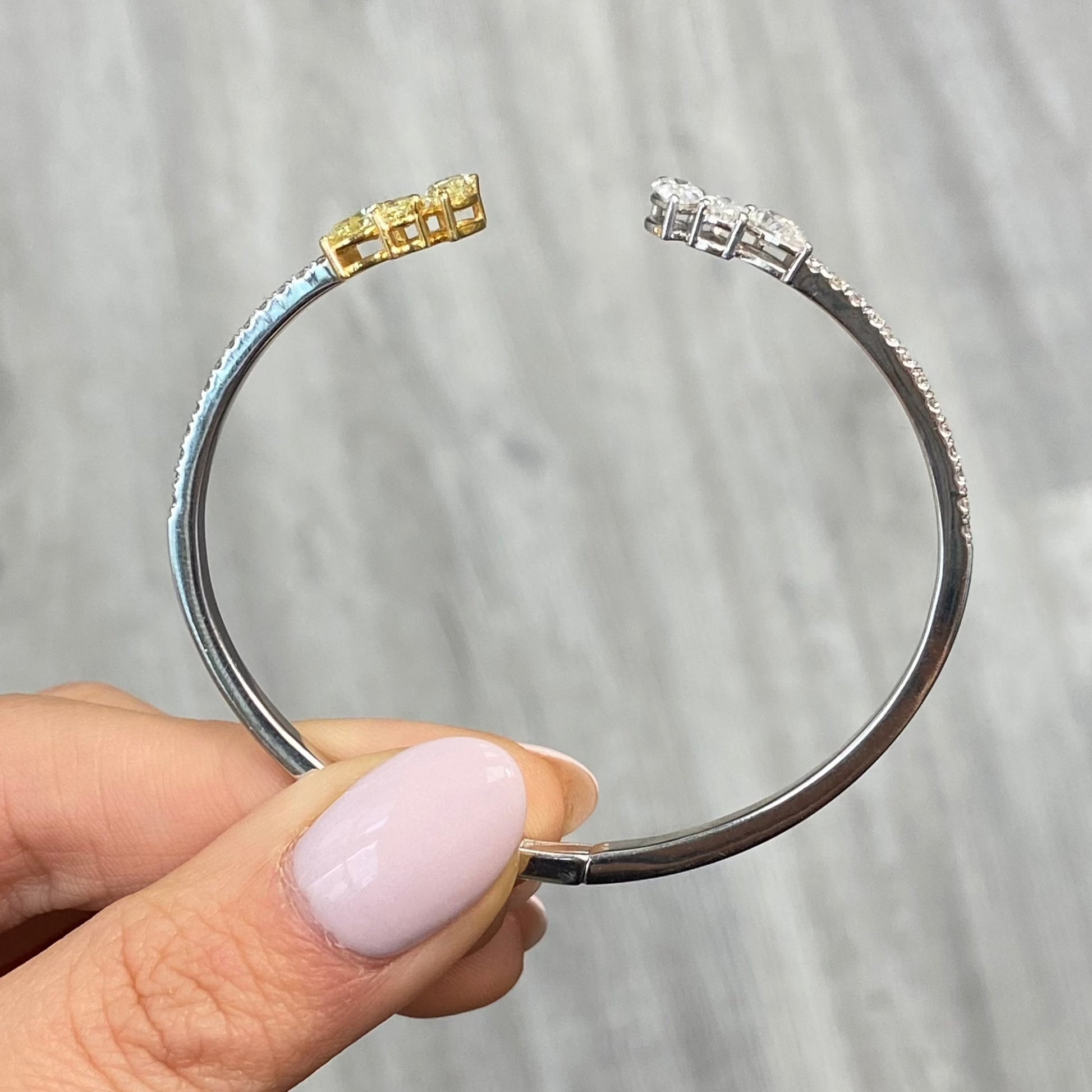yellow and white diamond bangle with all natural diamonds and pave on the band