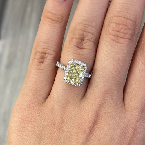 Yellow diamond engagement ring, radiant cut canary diamond with white diamond halo engagement ring