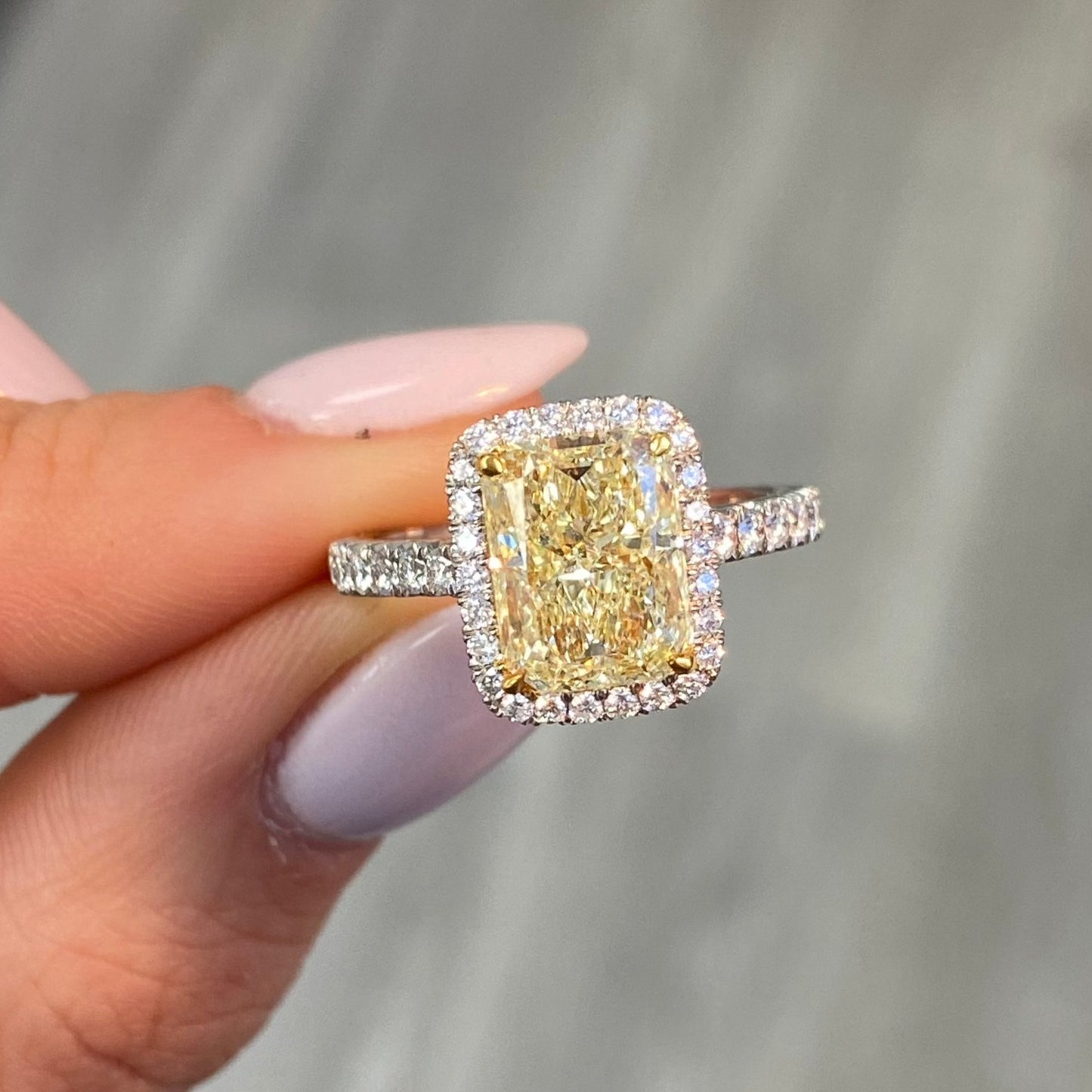 Yellow diamond engagement ring, radiant cut canary diamond with white diamond halo engagement ring