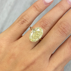 Fancy radiant yellow VS2 oval cut diamond, GIA certified.