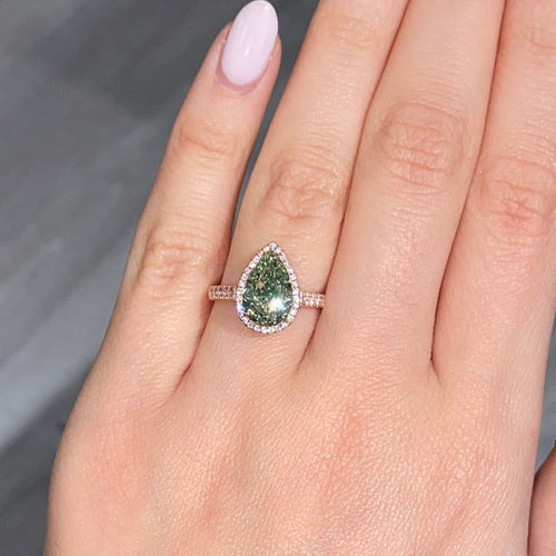 GIA Certified green diamond pear shape ring. Green diamond jewelry. JLO green diamond