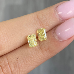 Fancy intense yellow diamond ring in pair, GIA certified.