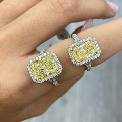 Yellow diamond ring with white surrounding diamonds