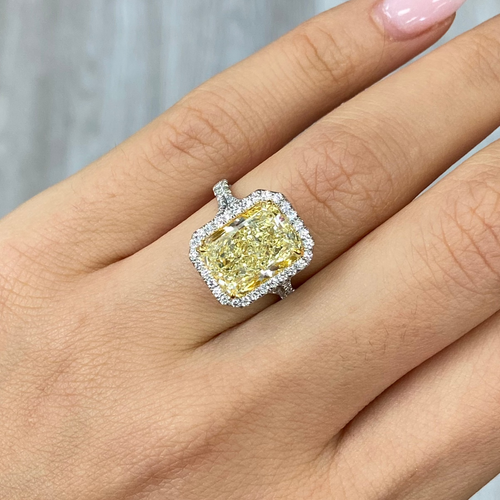 Elongated yellow diamond ring with white diamonds 