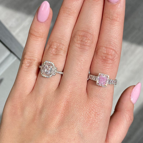 bubblegum pink diamond, pink radiant cut diamond surrounded by emerald cut and round diamonds, halo engagement ring with natural pink diamond