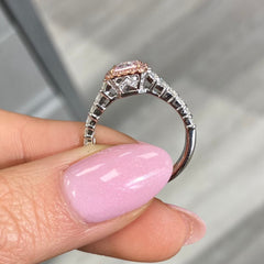 bubblegum pink diamond, pink radiant cut diamond surrounded by emerald cut and round diamonds, halo engagement ring with natural pink diamond