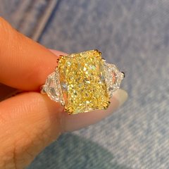 6.72ct Fancy Light Yellow Diamond Elongated Radiant Diamond Three Stone Ring