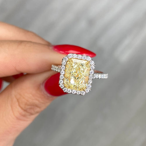 3.31 Carat  Light Yellow (W-X) VS2 Clarity  Radiant Cut Diamond  0.44 Carats of White Rounds  GIA Certified Diamond  Crafted in Platinum and 18k Yellow Gold  Handmade in NYC