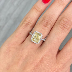 3.31 Carat  Light Yellow (W-X) VS2 Clarity  Radiant Cut Diamond  0.44 Carats of White Rounds  GIA Certified Diamond  Crafted in Platinum and 18k Yellow Gold  Handmade in NYC