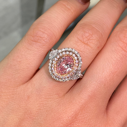 Ethereal natural pink oval diamond ring with a stunning halo design with SI1 clarity.