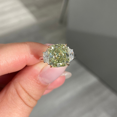 Fancy Yellow-Green cushion cut diamond engagement ring with VS2 clarity and a unique hue.