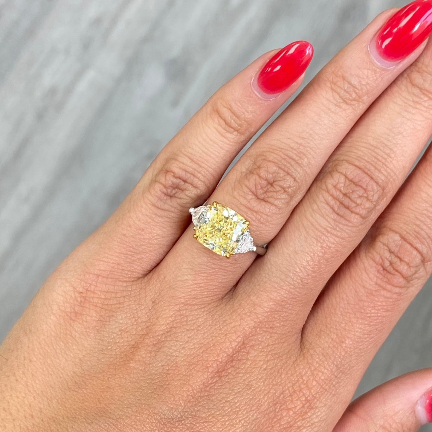 fancy yellow elongated cushion diamond elongated diamond canary diamond three stone engagement ring 