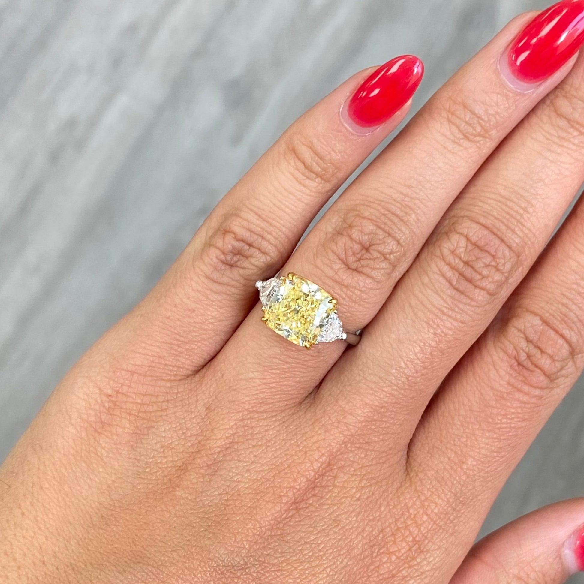 fancy yellow elongated cushion diamond elongated diamond canary diamond three stone engagement ring 