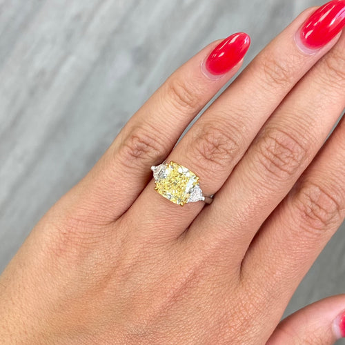 Fancy yellow elongated cushion diamond elongated diamond canary diamond three stone engagement ring, GIA certified.