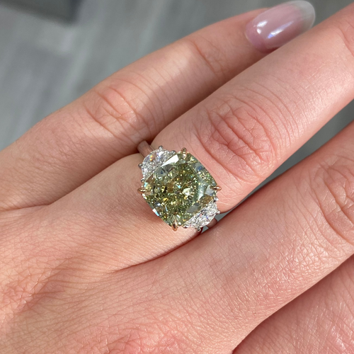 Fancy Yellow-Green cushion cut diamond engagement ring with VS2 clarity and a unique hue.