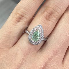 1.01 Carat Fancy Light Brownish Greenish Yellow Pear 0.50 Carats of surrounding diamonds VS1 Clarity Very Good, Excellent, None Fluorescence Handset in 18k Gold GIA Certified Diamond.