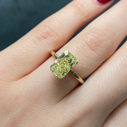 3 carat elongated radiant fancy intense yellow on female hand