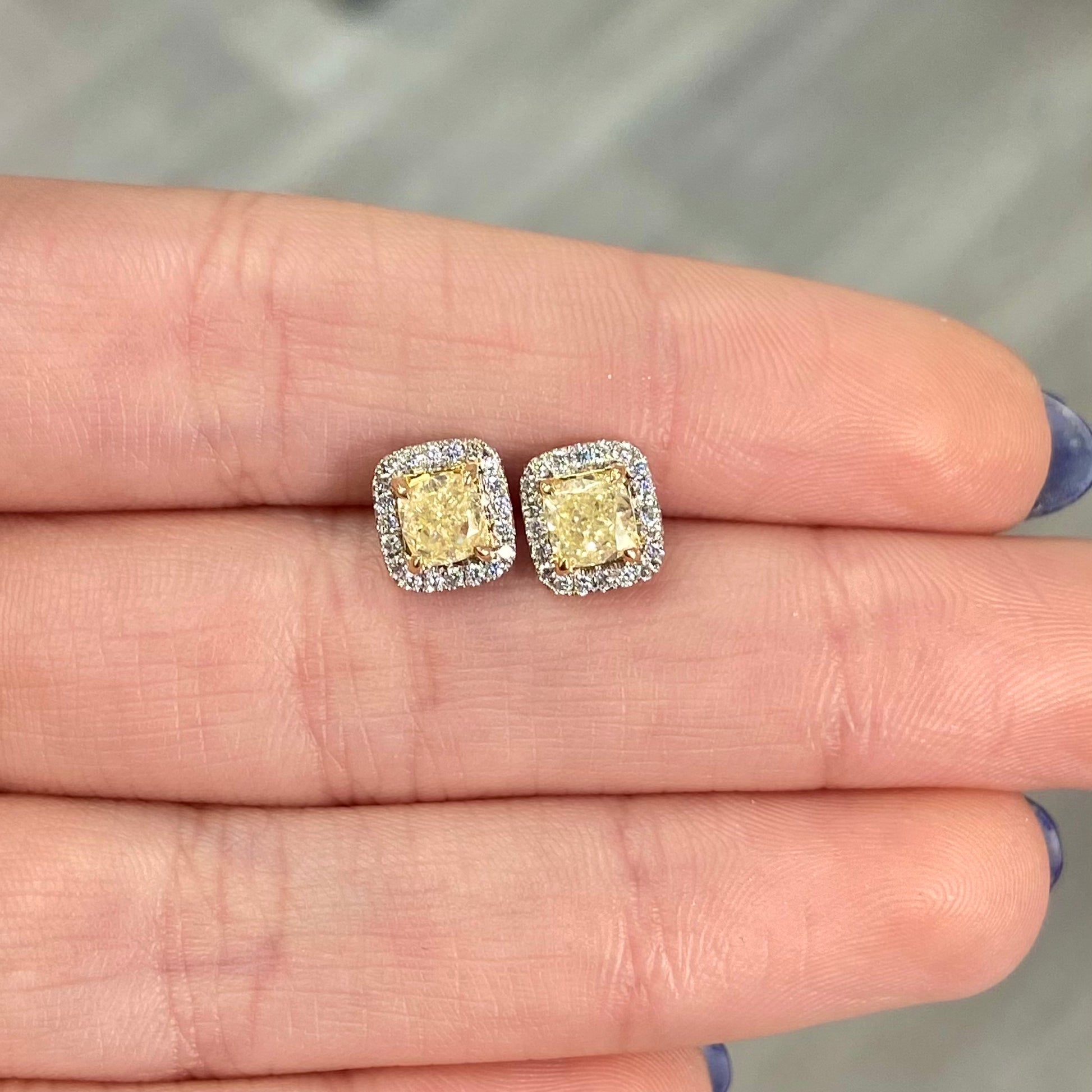 Fancy Light Yellow Cushion Diamond Studs 1.42 carat total center diamonds  Center diamonds are 0.71ct each  Surrounded by 0.22 Carats of White Radiant Diamonds Set in 18k Gold Handmade in NYC 