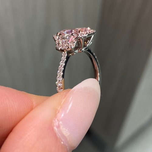 1.5 carat elongated radiant cut diamond ring. natural pink diamond ring, fancy light orangy pink diamond, halo diamond ring with pink diamond.