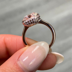 Elegant bezel set ring featuring a GIA certified very light pink cushion cut diamond.