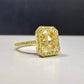 2.28 Carat Center Diamond GIA Light Yellow Diamond (Y-Z) Radiant Cut Diamond 0.30 Carats of Fancy Yellow Rounds VS1 Clarity Medium Blue Fluorescence Excellent, Very Good cutting Set in 18k Yellow Gold GIA Certified Diamond Handmade in NYC