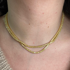 Luxurious tennis necklace featuring natural yellow cushion cut diamonds with VS-VVS clarity.