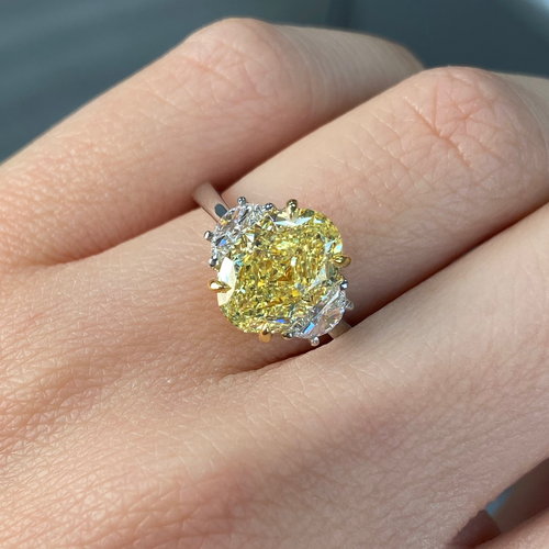 Stunning yellow oval cut diamond engagement ring featuring SI1 clarity.