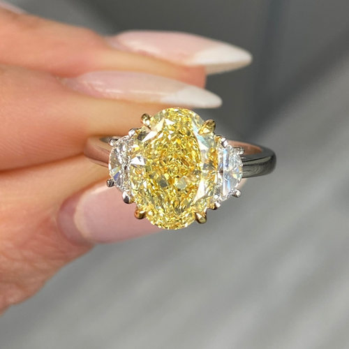 Stunning yellow oval cut diamond engagement ring featuring SI1 clarity.