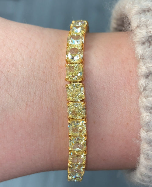 GIA certified fancy yellow cushion cut diamond bracelet featuring VS+ clarity.