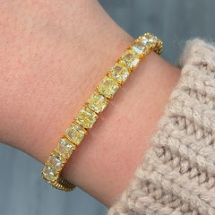 GIA certified fancy yellow cushion cut diamond bracelet featuring VS+ clarity.