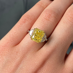 GIA certified fancy vivid yellow elongated radiant diamond engagement ring, internally flawless and stunning.