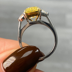 GIA certified fancy vivid yellow elongated radiant diamond engagement ring, internally flawless and stunning.