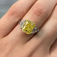 GIA certified fancy vivid yellow elongated radiant diamond engagement ring, internally flawless and stunning.