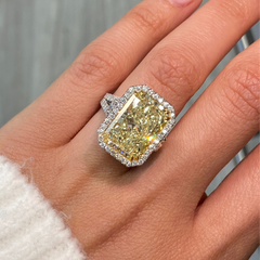 GIA certified elongated radiant yellow diamond halo ring, featuring a soft and sweet yellow hue.