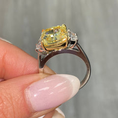 GIA certified Fancy Yellow Cushion Diamond Engagement Ring with VS2 clarity and excellent cutting.