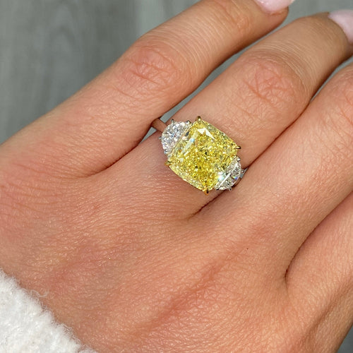 GIA certified Fancy Yellow Cushion Diamond Engagement Ring with VS2 clarity and excellent cutting.